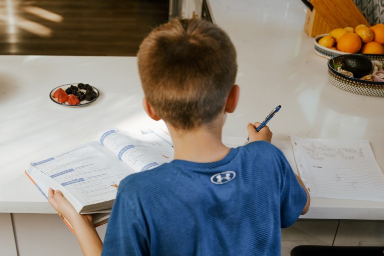 Julie Frumin and her two children, who are in 3rd grade and 6th grade, at their home in Thousand Oaks, Calif., on Feb. 5, 2026.