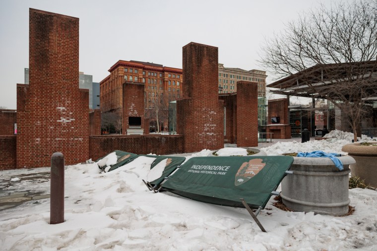 Signage for Independence National Historical Park is covered in snow ahead the rally Avenging The Ancestors Coalition at the President's House Site in Philadelphia on Feb. 10.