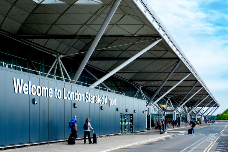 Passengers outside London Stansted Airport