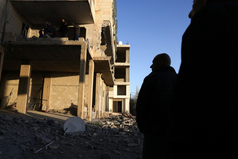 Palestinian man surveys the remains of the home of Palestinian Mahmud Abed, killed by the Israeli military in 2025, after it was demolished by explosive devises by the Israeli military, in the village of Halhoul, in the north of the occupied West Bank city of Hebron on February 2, 2026. 