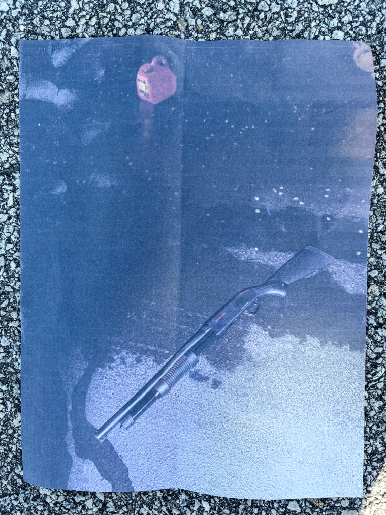 A gas canister and gun on the concrete