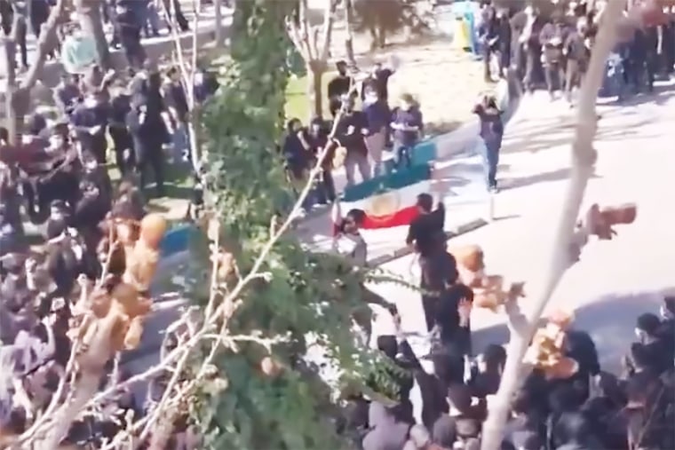 Video shared on Feb. 22 and verified by NBC News shows students raising an Iranian flag during a protest in Shariff University in Tehran. 