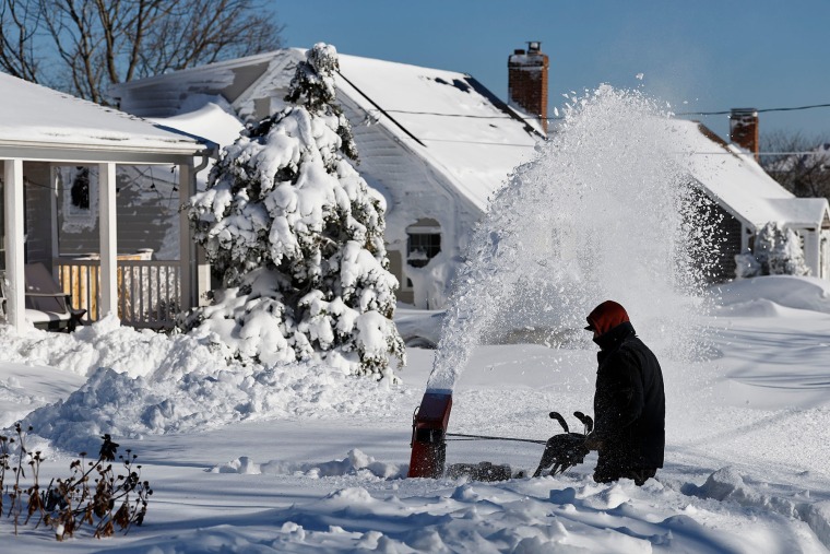 Gene Herbert, 80, begins digging out his home on Tuesday, Feb. 24, 2026, in Scituate, Mass.