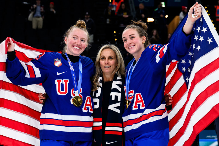 Ellen Hughes celebrates with Grace Zumwinkle, left, and Taylor Heise after the women's ice hockey final on Feb. 19, 2026 in Milan.