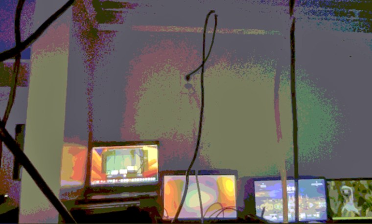 Nisos used the webcam on a laptop to view what was likely a laptop farm.