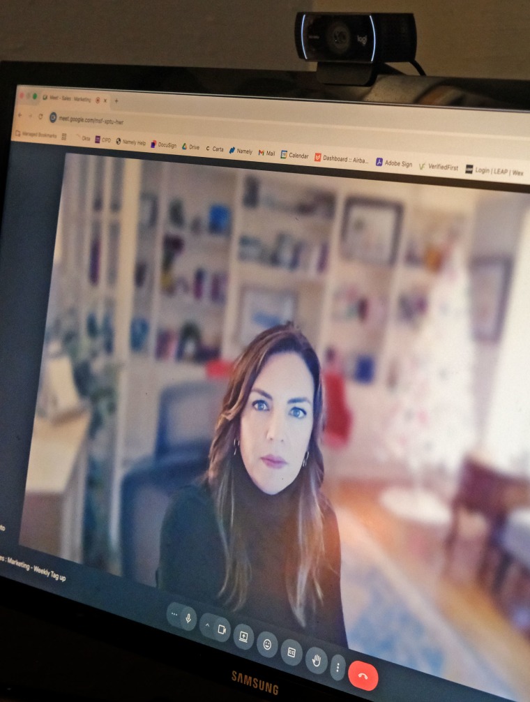 Magen Gacino works in her home office in Liberty, Mo.