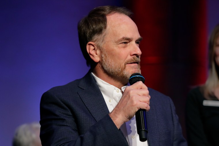 Texas House incumbent Rep. Steve Toth speaking on a microphone.