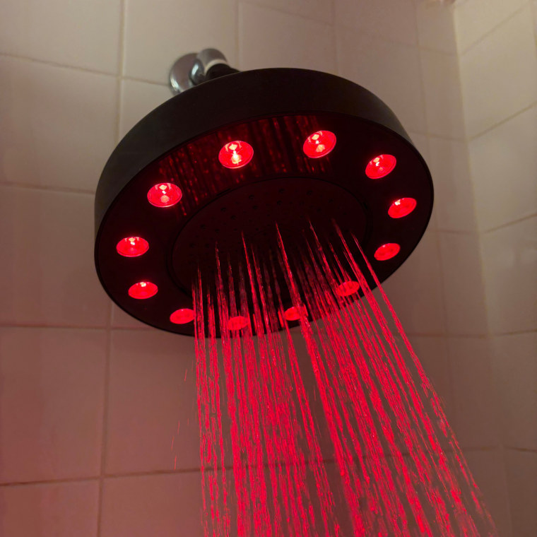 Running showerhead with red light ring