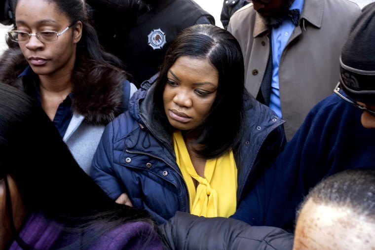 Tova Noel, center in yellow blouse, leaves federal court in New York on Nov. 25, 2019.