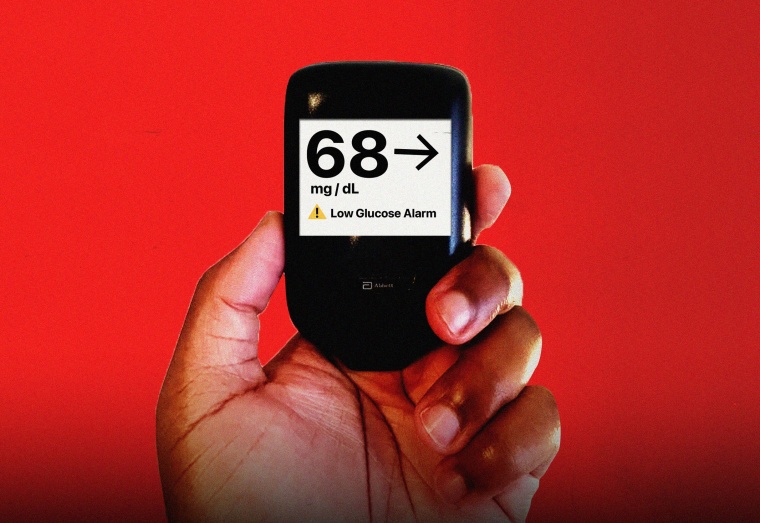 Hand holding glucose monitor that reads "68 mg/dL" 