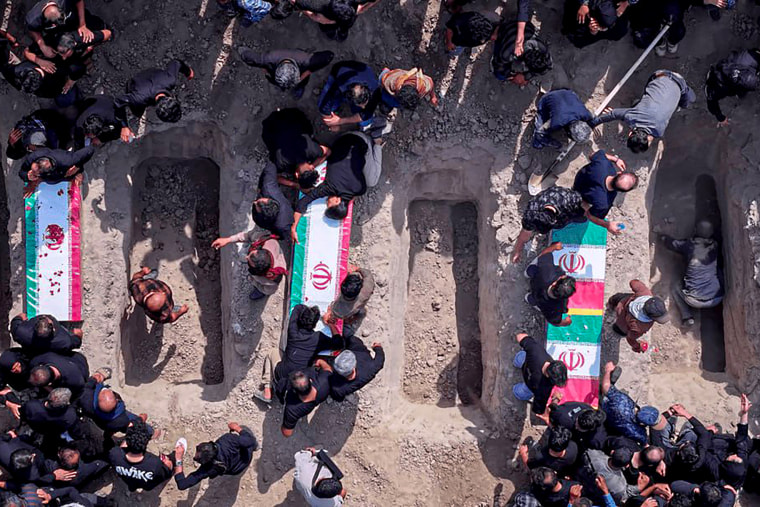 Iran holds a funeral ceremony for students and staff members of the Shajareh Tayyebeh girls' elementary school.