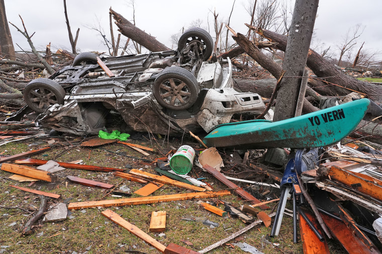 A damaged vehicle lies upside down on March 11, 2026, following a powerful storm that hit Aroma Park, Illinois, the day before.