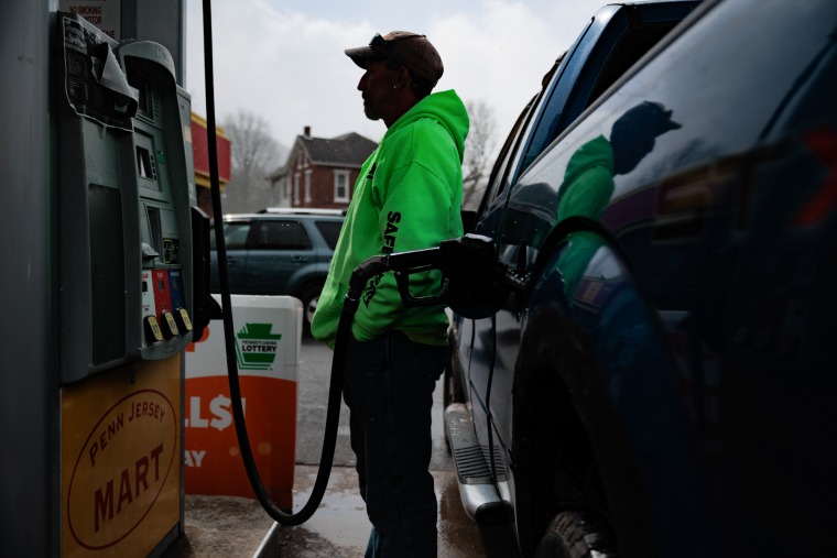 Henry Cooper pumps gas at Penn Jersey Mart gas station