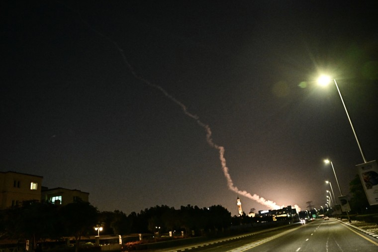 Smoke from a reported rocket interception is seen in the sky over Dubai