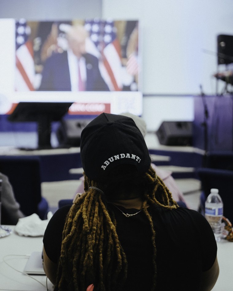 Church members listen to Michelle Renee's crypto presentation at church.