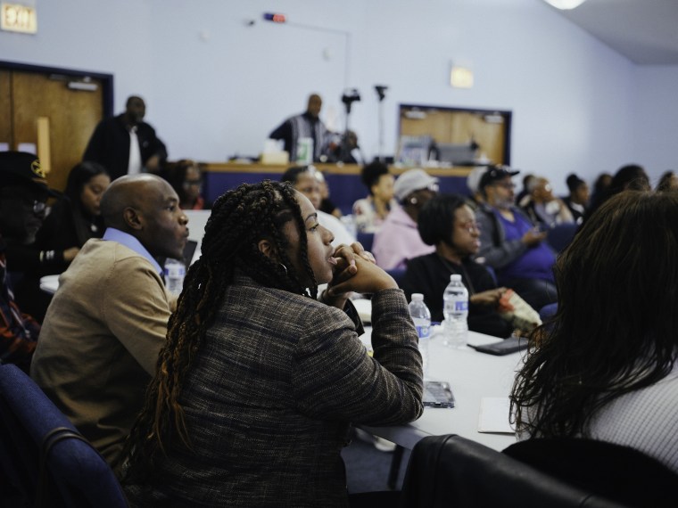 Church members listen to Michelle Renee's crypto presentation at church.