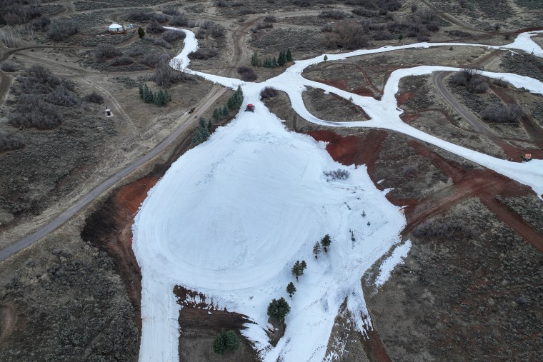 The snow preservation pile at Soldier Hollow Nordic Center spans approximately
15,000 square feet. Snow from the venue was shaped into a 300-by-110-by-30-foot
mound before being insulated March 6–8 for summer preservation