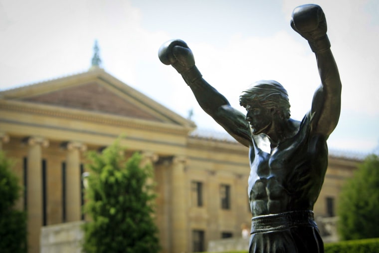 The bronze statue of Sylvester Stallone portraying the boxer from the film "Rocky" near the steps of the Philadelphia Museum of Art.