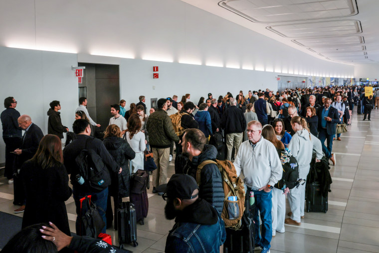 People wait in line.
