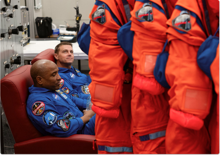 Victor Glover and Reid Wiseman seen alongside the Orion Crew Survival System spacesuits on Jan. 17.