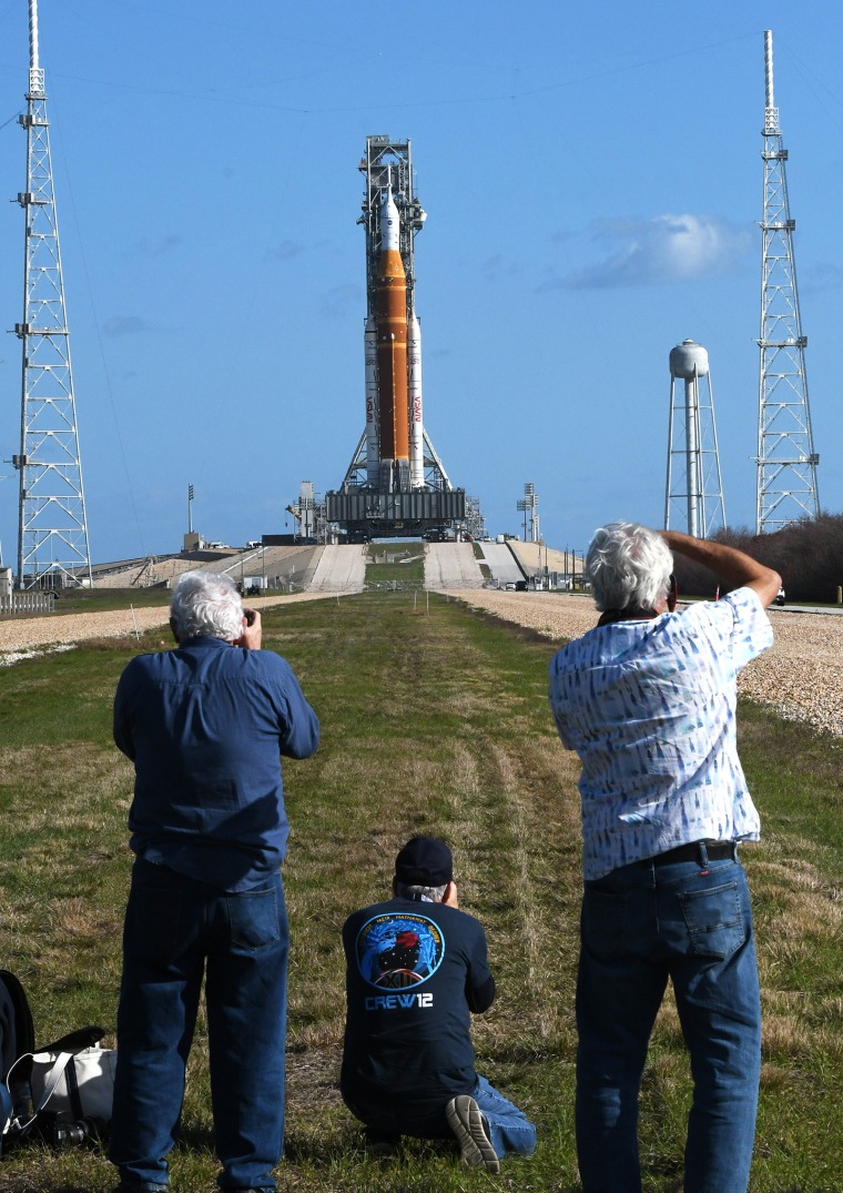 Media members photograph the Space Launch System rocket and Orion spacecraft at the Kennedy Space Center on March 20.