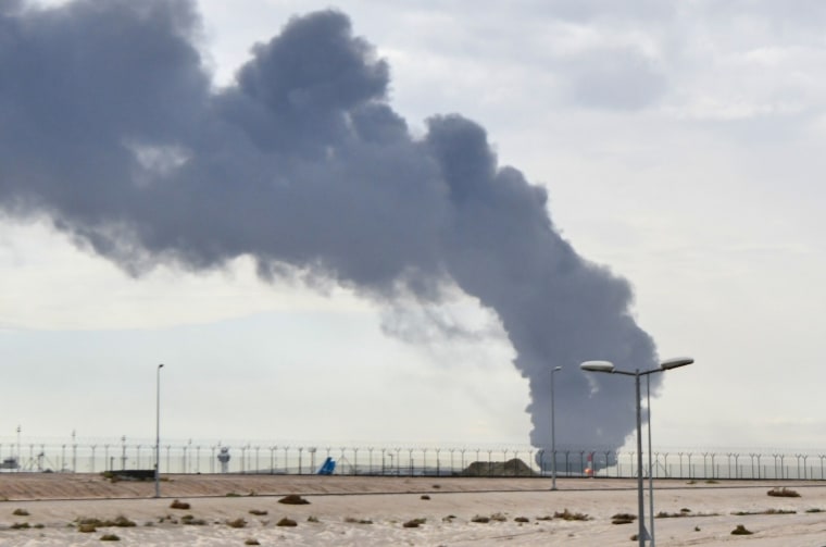 Smoke rises after an Iranian drone attack on a fuel depot at Kuwait International Airport on March 25, 2026.