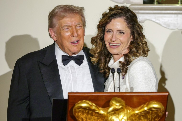 Image: U.S. President Donald Trump stands with U.S. Rep Julia Letlow during the Congressional Ball