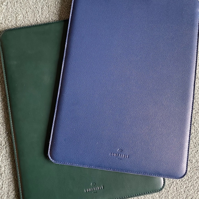 Image of two leather laptop sleeves on a table.