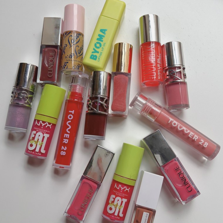 Pile of lip oils on a table