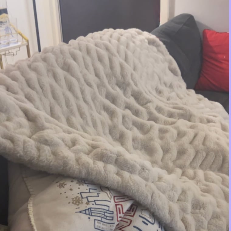 Throw blanket draped over couch