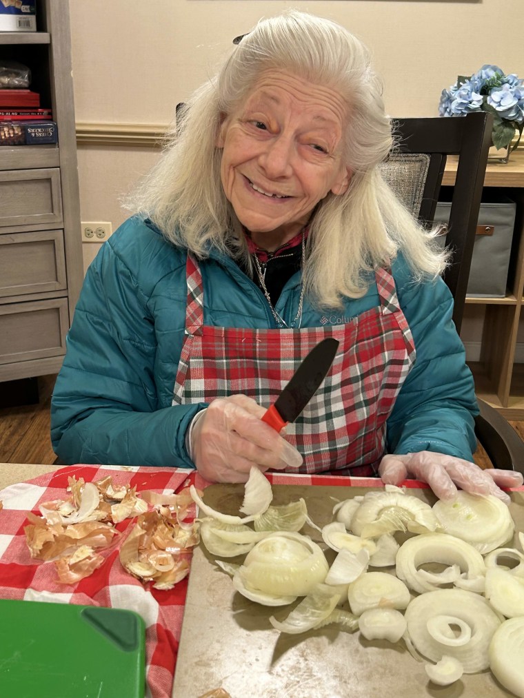 Jenny chops onions as part of the Rolling Scones cooking club.