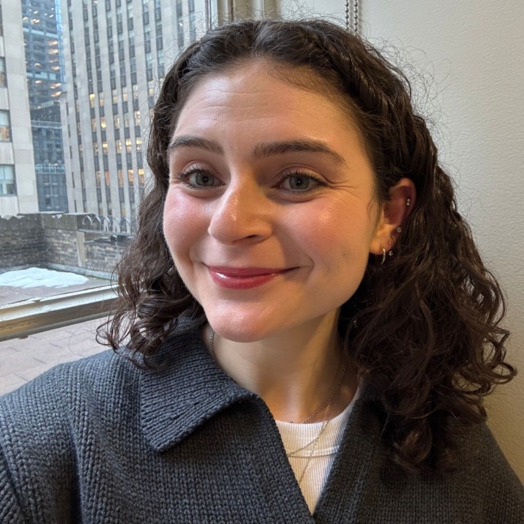 Woman after applying lip oil to lips