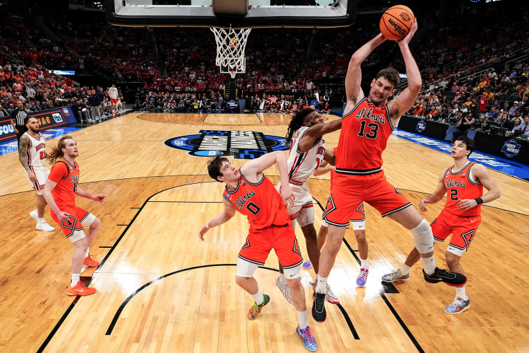 On-court action during an NCAA basketball game.