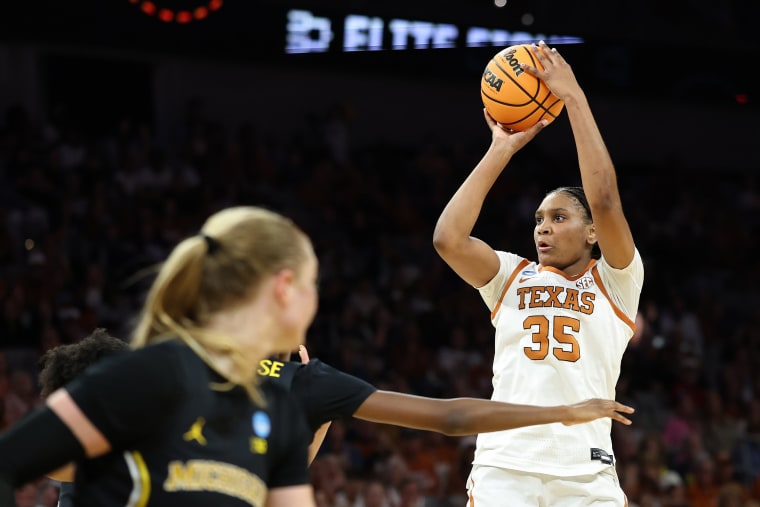 Madison Booker of the Texas Longhorns attempts a shot 