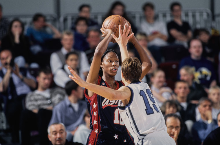 On-court action during a women's basketball game.