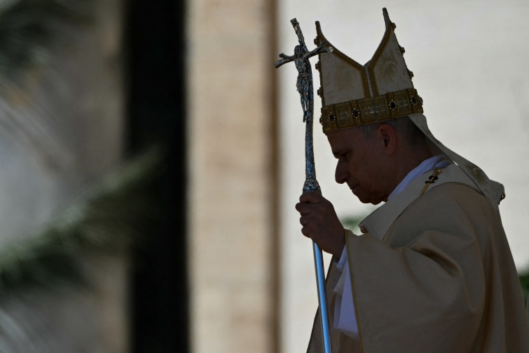 Pope Leo XIV leaves at the end of the Easter Mass as part of the Holy Week celebrations, at St Peter's Square in the Vatican on April 5.