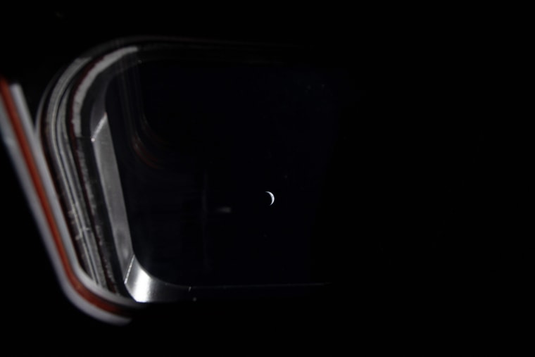 A sliver of planet Earth as seen from the window of a spacecraft