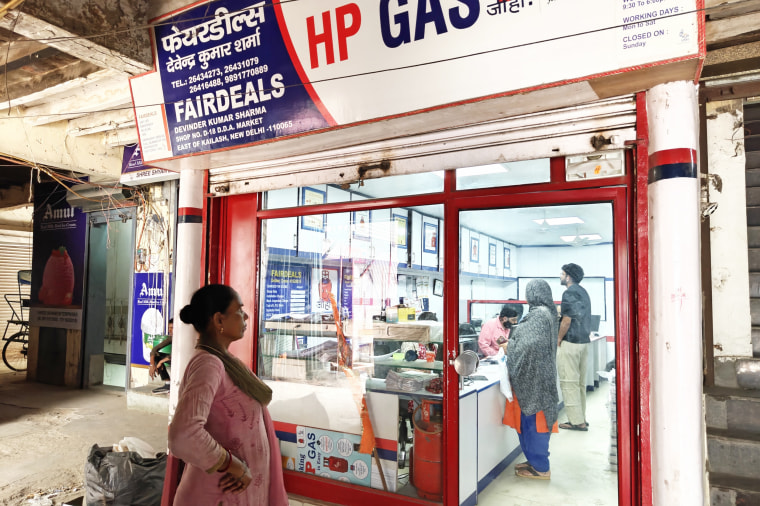 Anita Devi awaits her turn to inquire about a piped gas connection in Delhi on Friday.