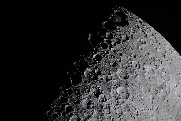 A portion of the Moon coming into view along the terminator