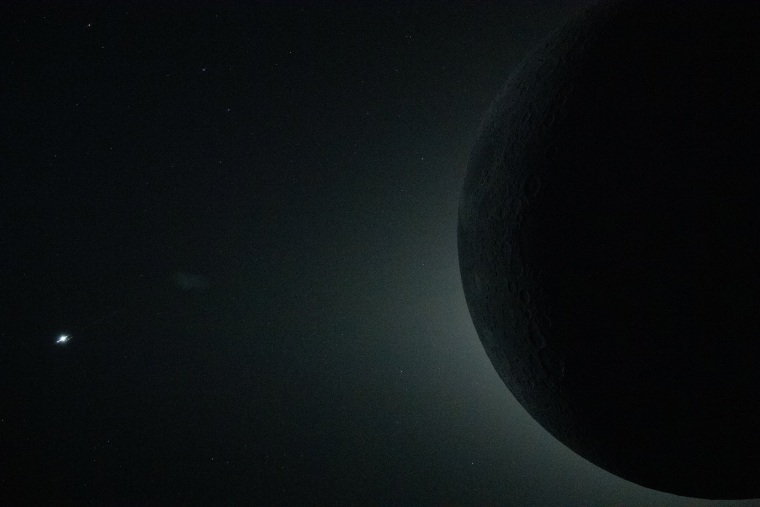 A total solar eclipse with only part of the Moon visible in the frame as it fully obscures the Sun, as seen from the Orion spacecraft on April 6, 2026.