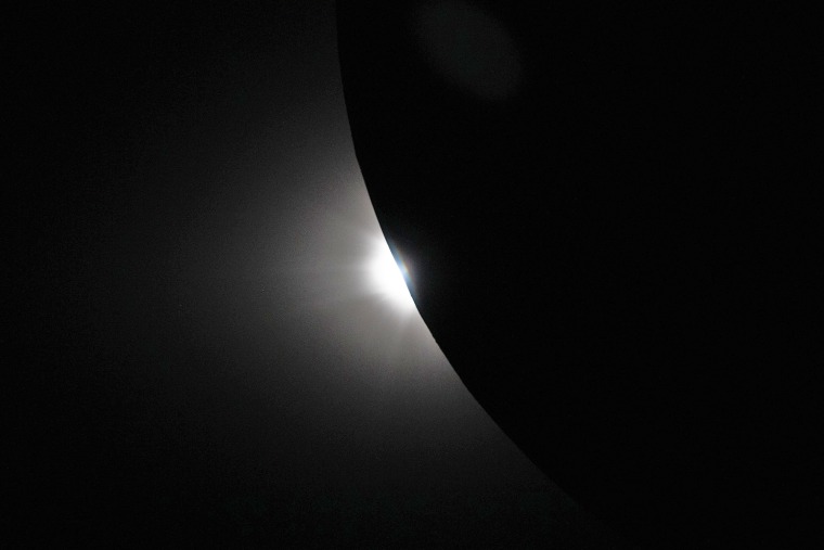 The Sun begins to peek out from behind the moon as the eclipse transitions out of totality as seen from the Orion spacecraft on Monday, April 6, 2026.