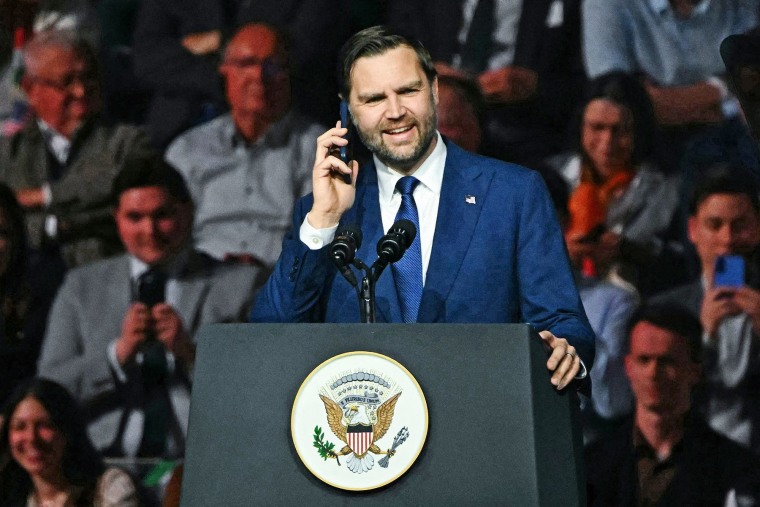 Vice President JD Vance speaks on a call with President Donald Trump during a campaign rally in Budapest, Hungary on April 7, 2026. 