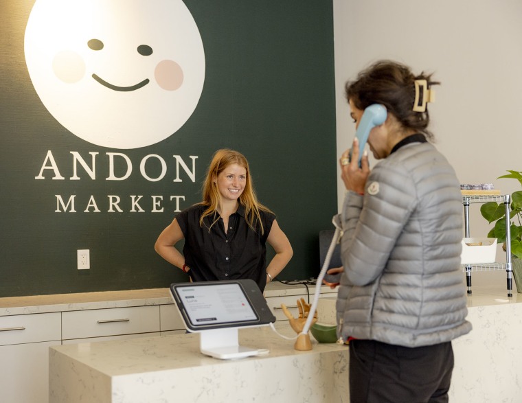 Leah Stamm helps a customer check out with Luna at the AI-run Andon Market in San Francisco on April 10, 2026.