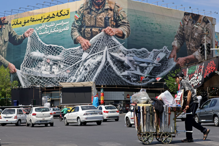 A billboard reading 'The Strait of Hormuz remains closed" on display in Revolution Square, in Tehran, Iran on Sunday.