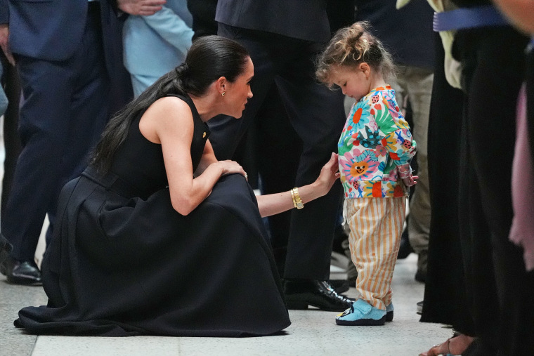 Meghan, Duchess of Sussex, meets a young patient on a visit to the Royal Children's Hospital