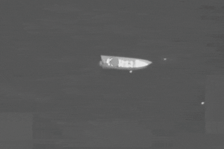Smoke rises from a boat after a U.S. strike in the Eastern Pacific on April 13, 2026. 