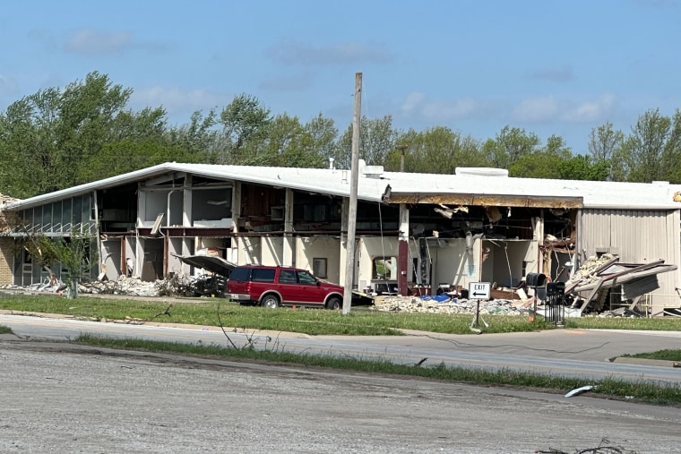 A damaged building with walls blown off as seen from outiside