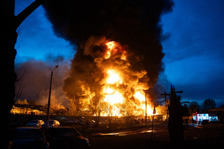  Fire burns at the site of recycling materials following a Russian strike in Kyiv