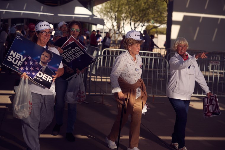 Guests leaving the “Build the Red Wall” event on Friday.