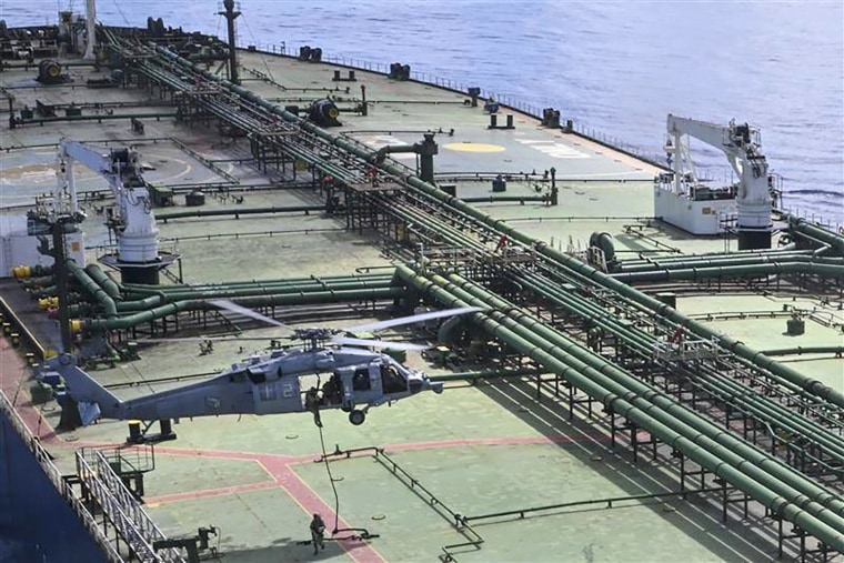 Images released by the Defense Department appear to show U.S. troops boarding the sanctioned stateless vessel M/T Majestic X.